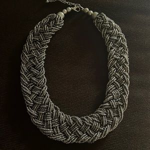 Pewter (grayish silver) necklace.
